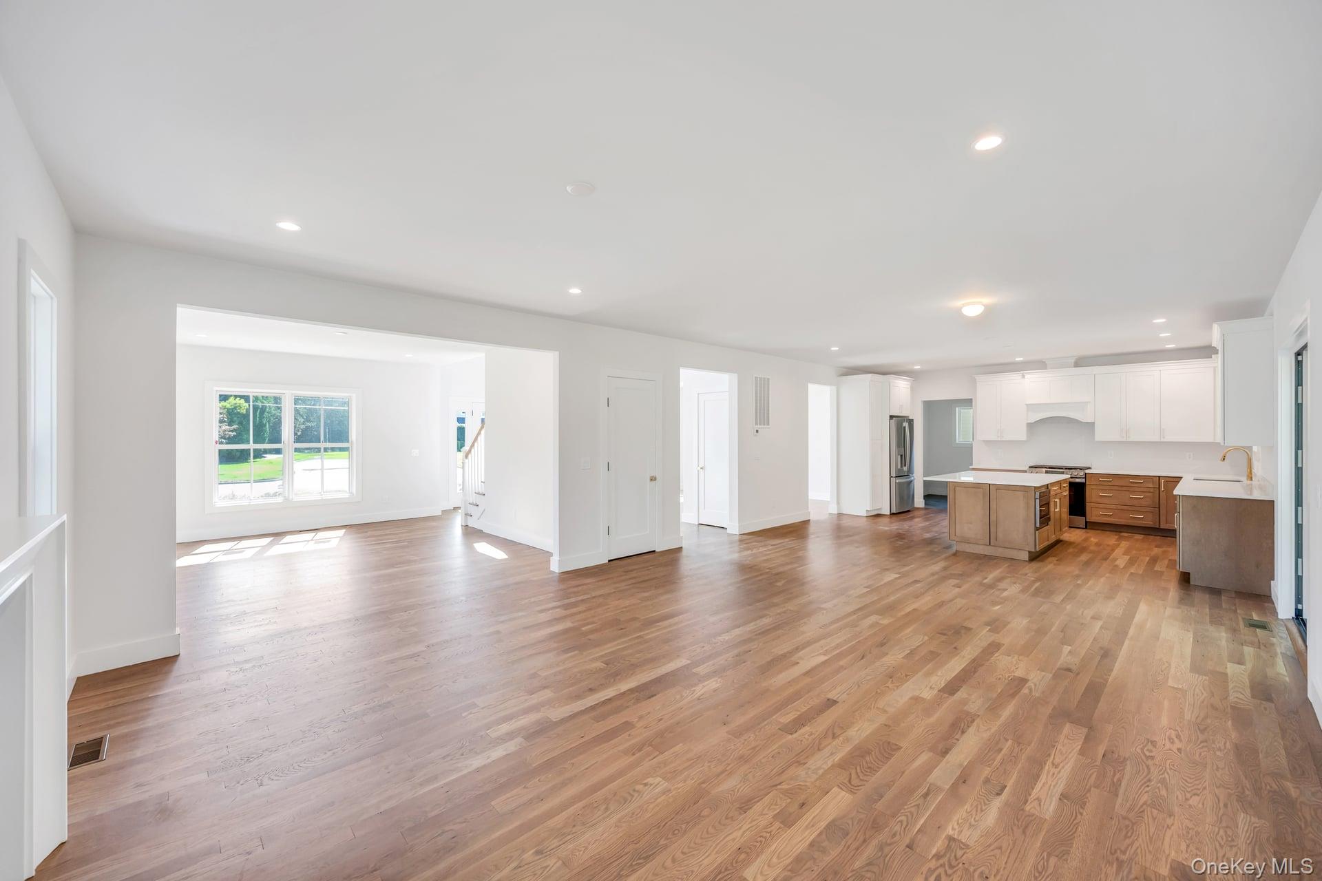 84 James Hawkins Road Moriches, NY 11955 - Photo 19 of 50 a view of a kitchen with wooden floor and a window