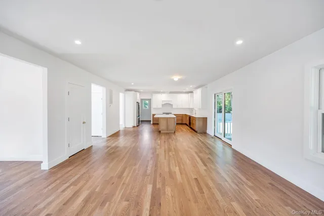 a view of a livingroom with wooden floor