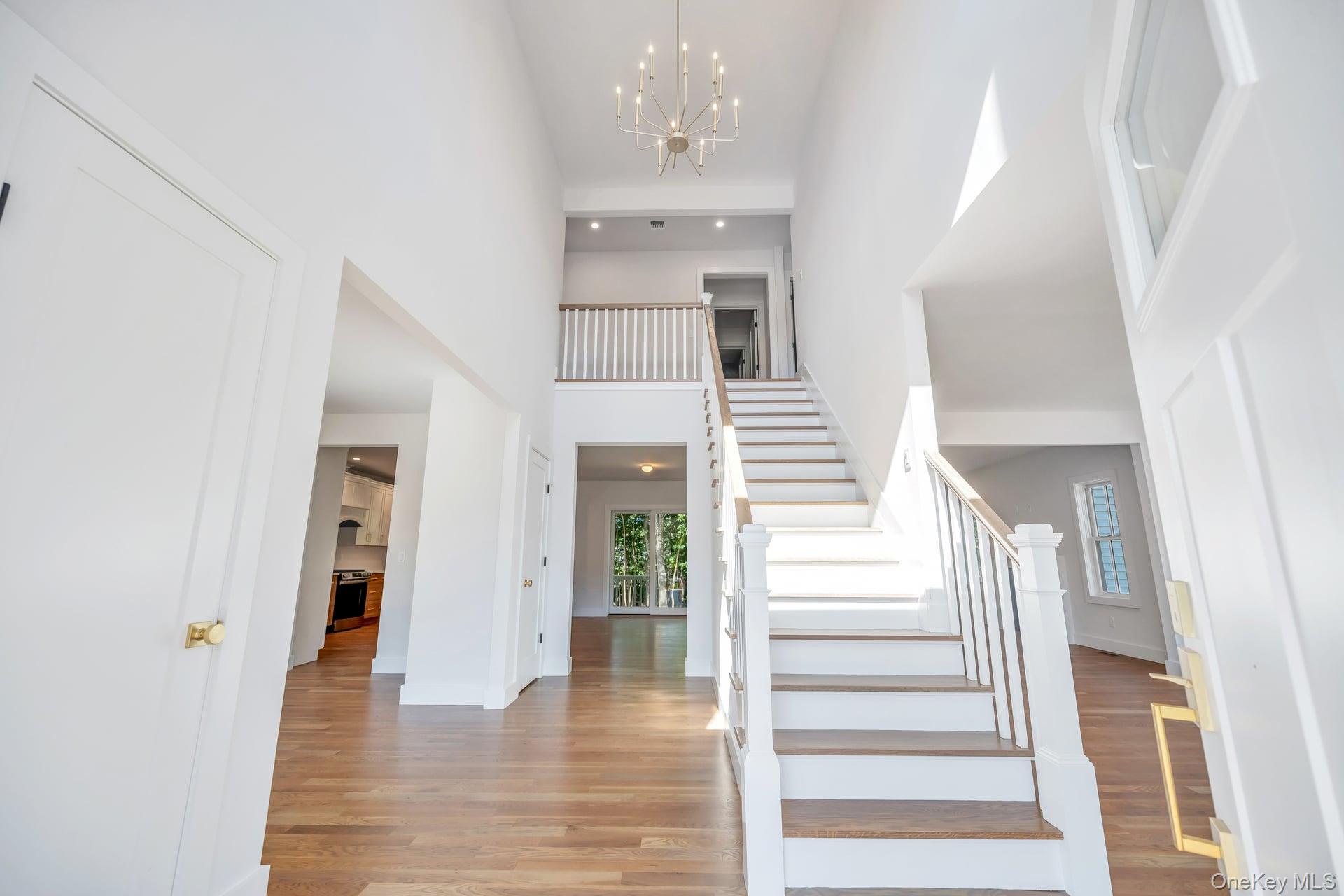 84 James Hawkins Road Moriches, NY 11955 - Photo 22 of 50 a view of a hallway with wooden floor and entryway