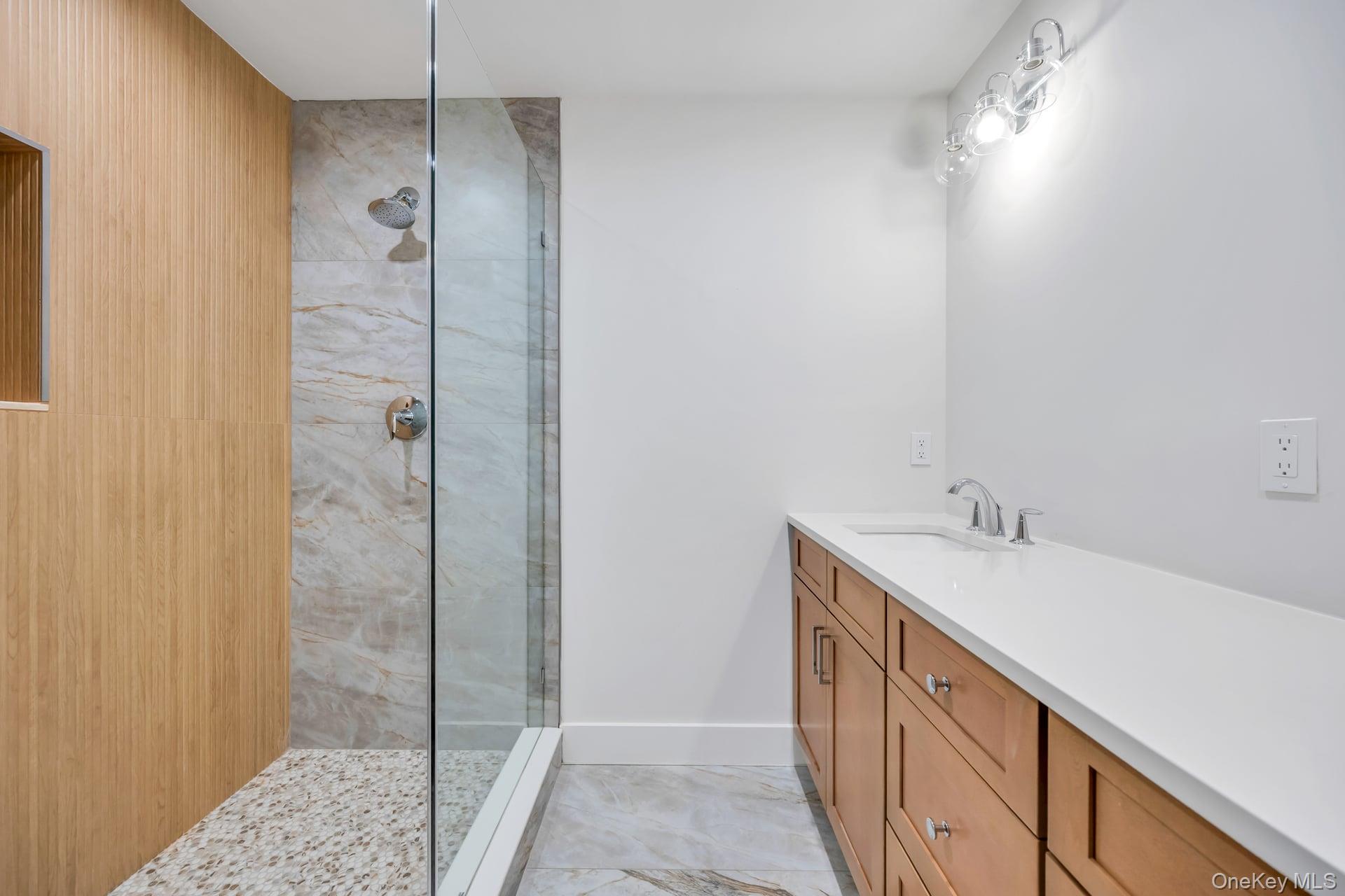 84 James Hawkins Road Moriches, NY 11955 - Photo 37 of 50 a bathroom with a sink and a mirror