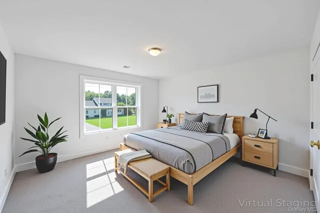 a bed room with a bed and a potted plant