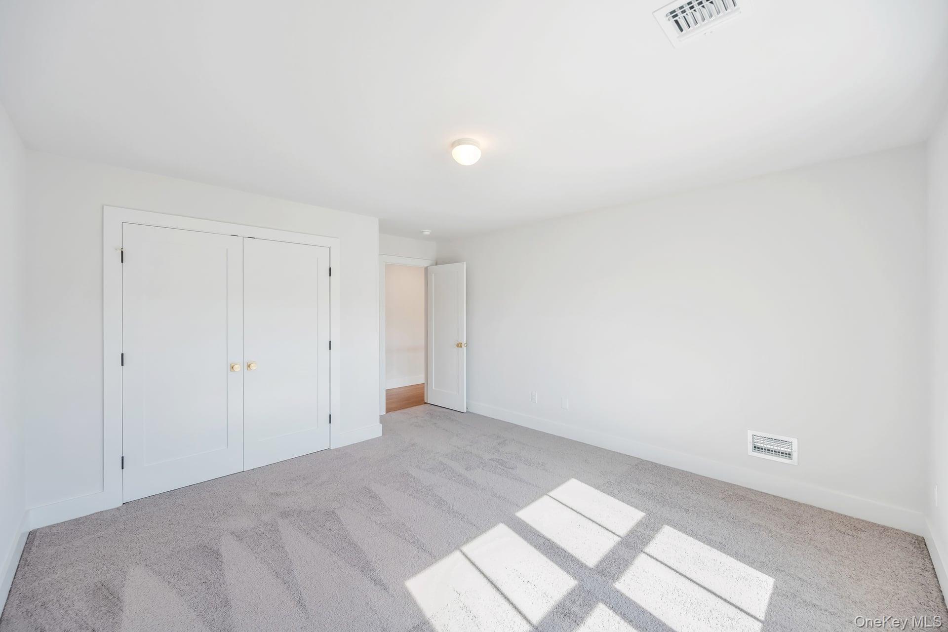 84 James Hawkins Road Moriches, NY 11955 - Photo 41 of 50 a view of an empty room