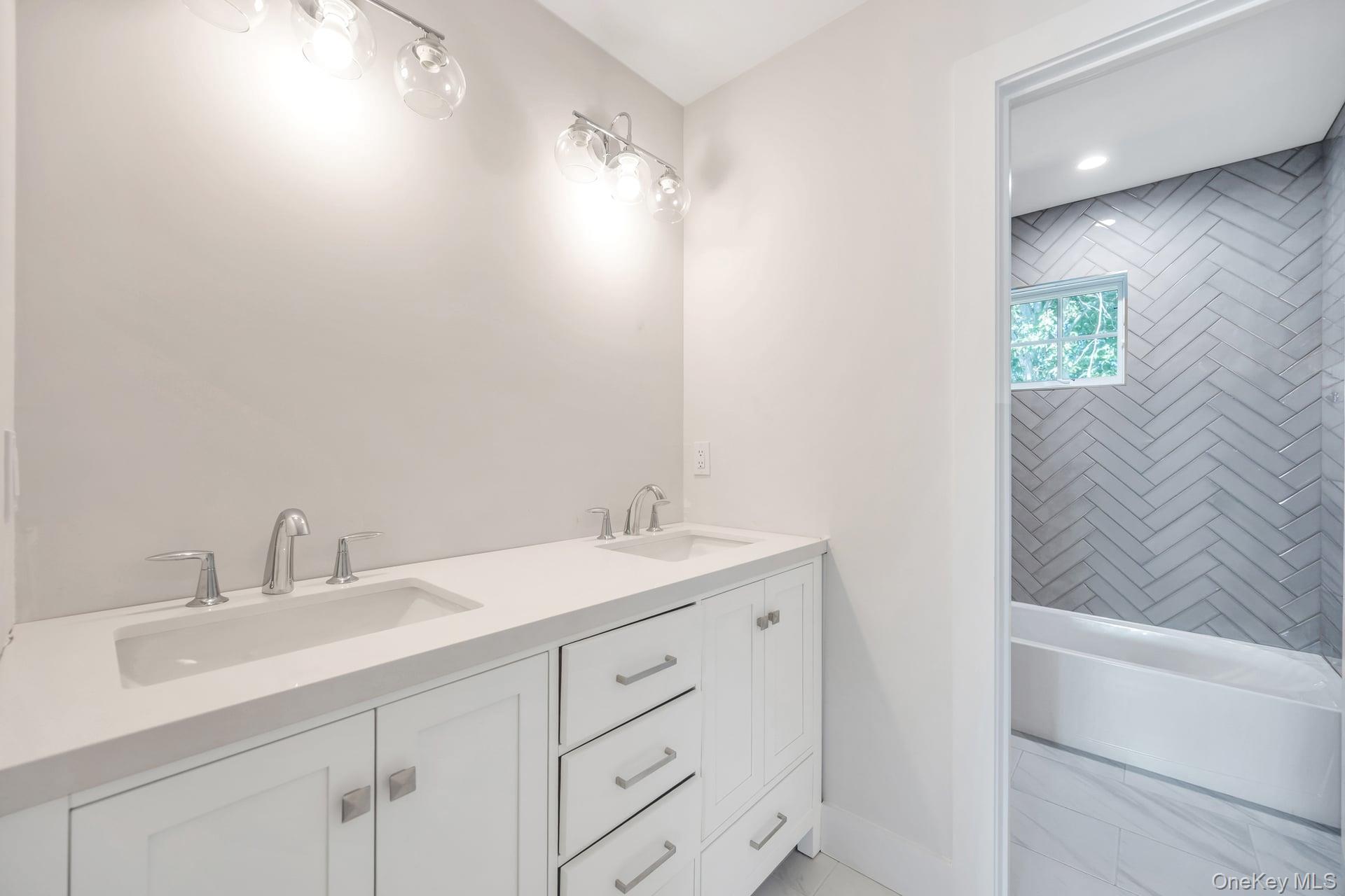 84 James Hawkins Road Moriches, NY 11955 - Photo 43 of 50 a bathroom with a sink and a mirror
