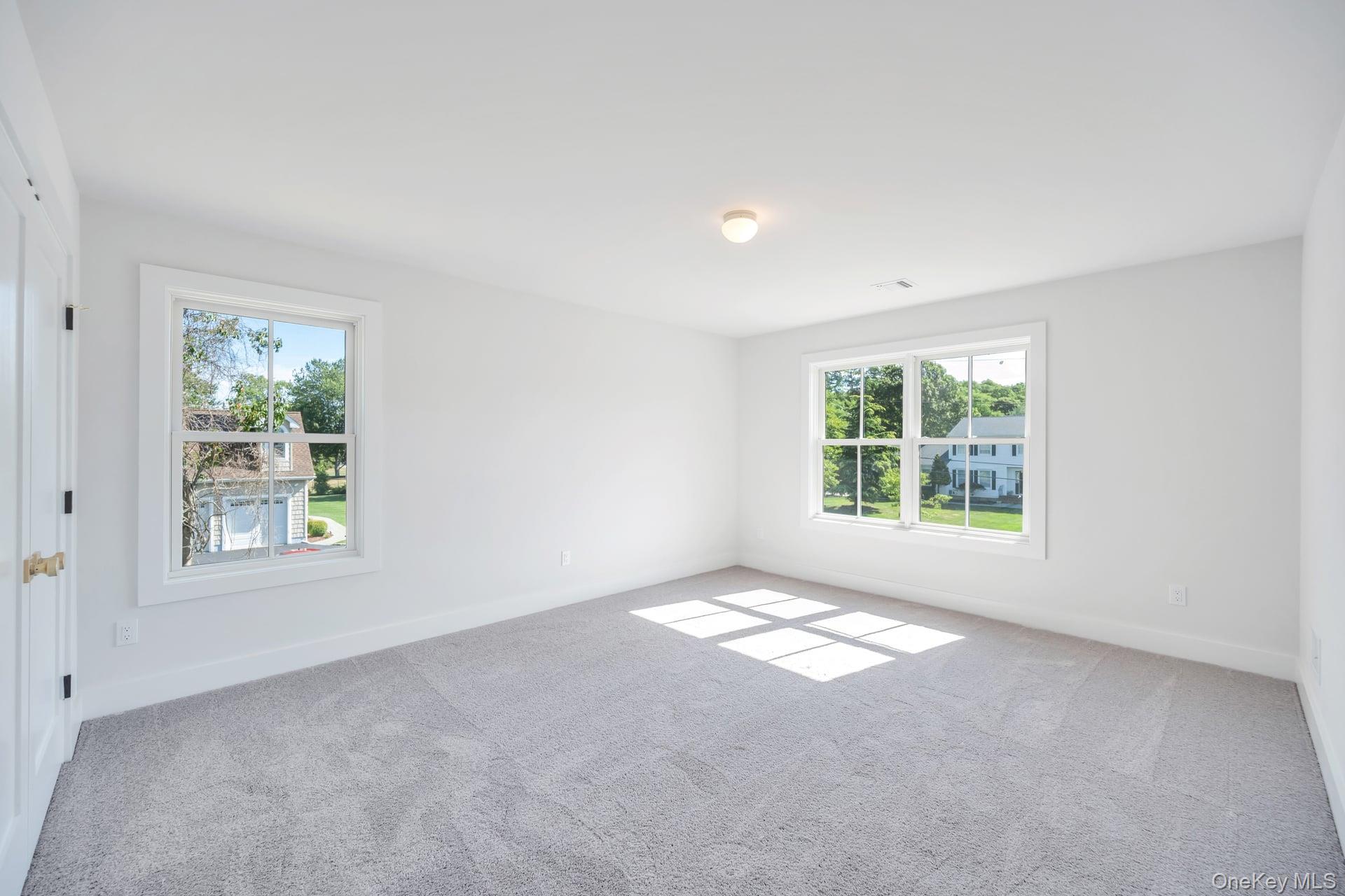 84 James Hawkins Road Moriches, NY 11955 - Photo 46 of 50 an empty room with windows