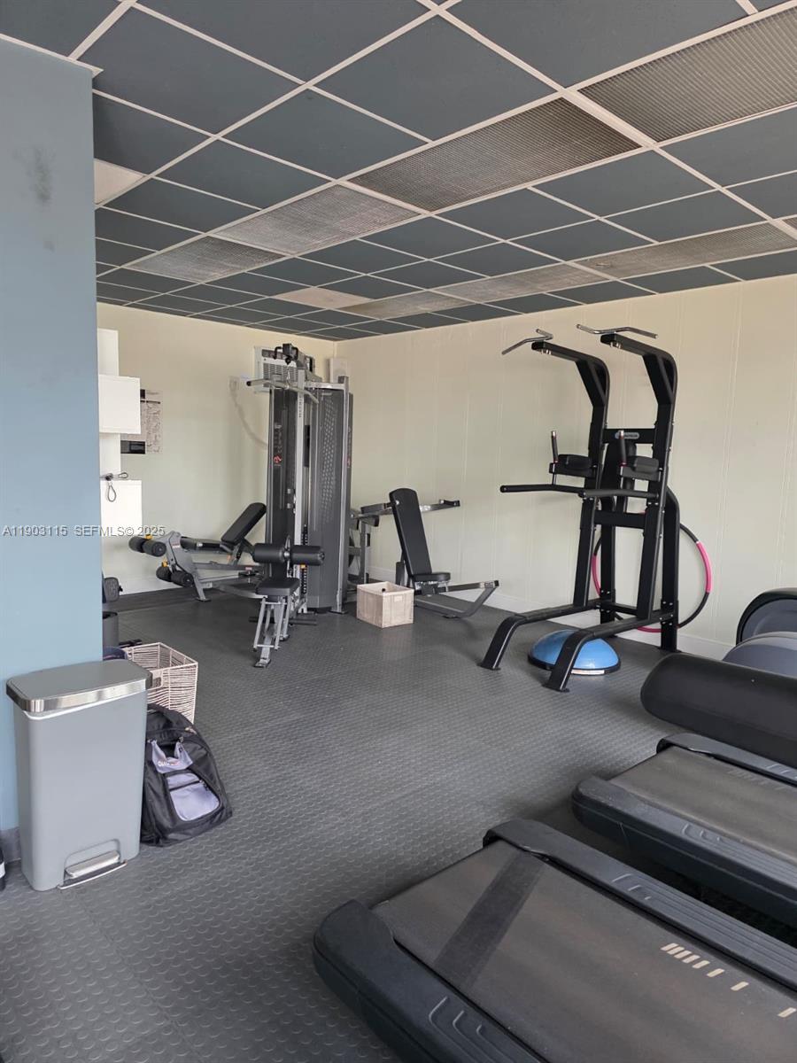 9102 West Bay Harbor Drive, Unit 4C Bay Harbor Islands, FL 33154 - Photo 17 of 26 a view of a room with gym equipment