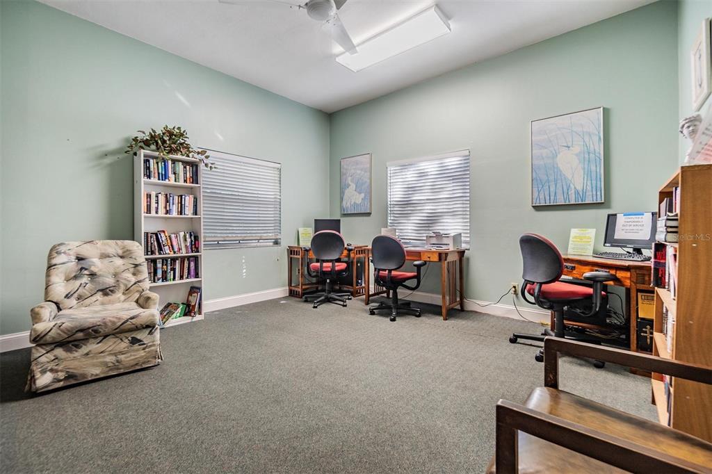 12760 Indian Rocks Road, Unit 104 Largo, FL 33774 - Photo 27 of 37 a view of a livingroom with workspace and a couch