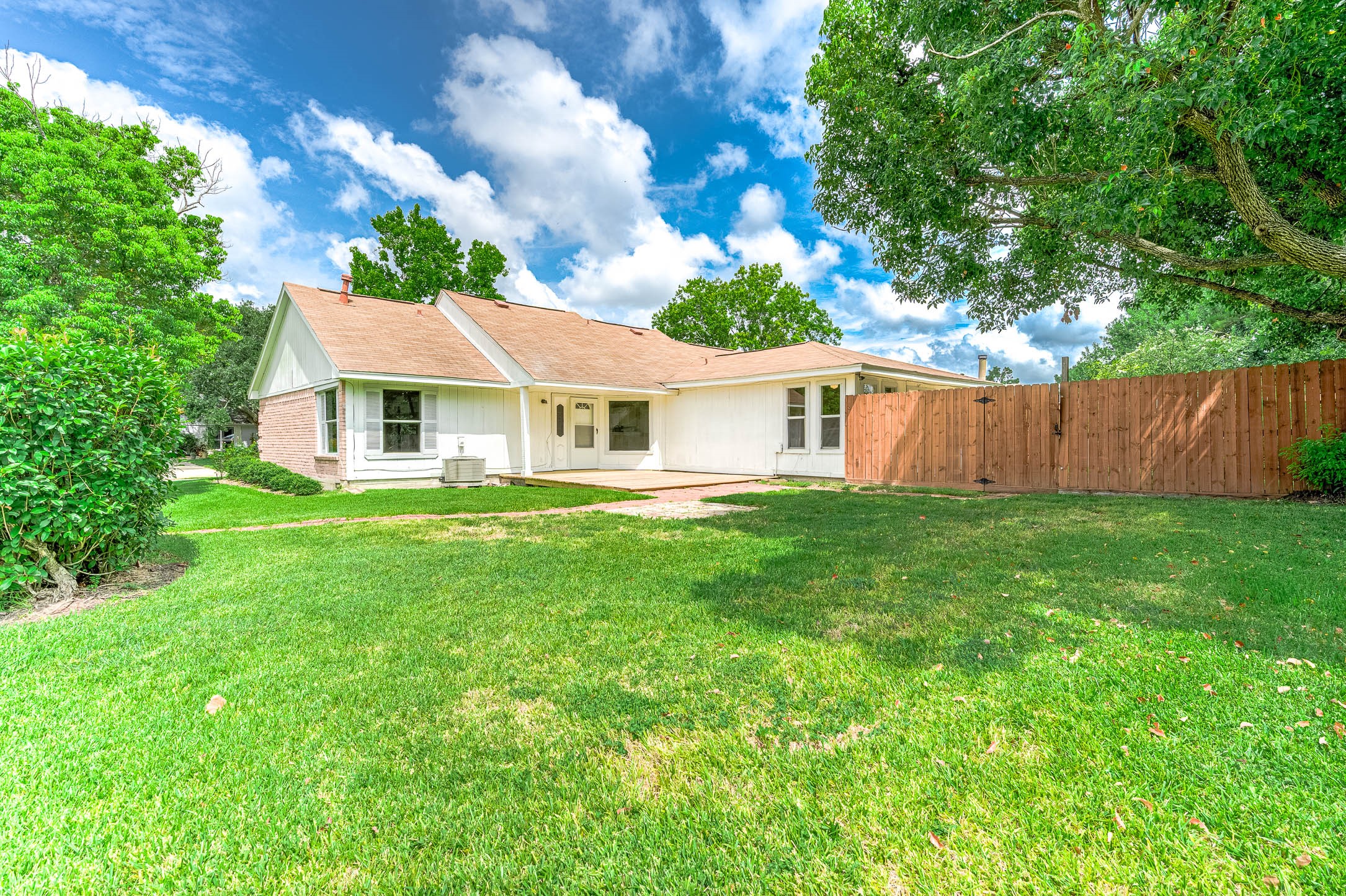 915 West Primrose Meadows Circle Pearland, TX 77584 - Photo 25 of 31 a view of house with a yard