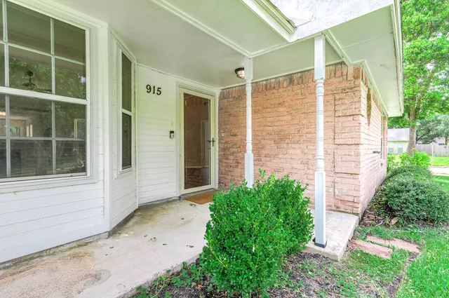 a view of front door and yard