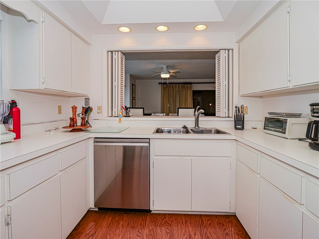 1001 Bay Road, Unit 205 Vero Beach, FL 32963 - Photo 12 of 36 a kitchen with sink and cabinets