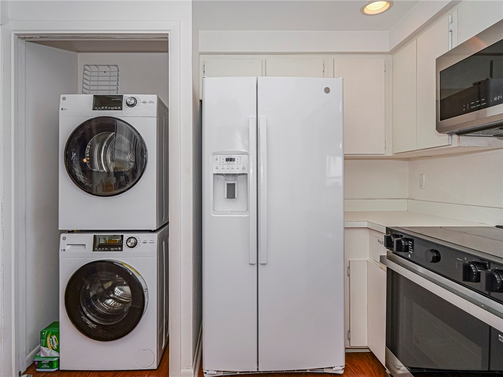 1001 Bay Road, Unit 205 Vero Beach, FL 32963 - Photo 15 of 36 a utility room with sink dryer and washer