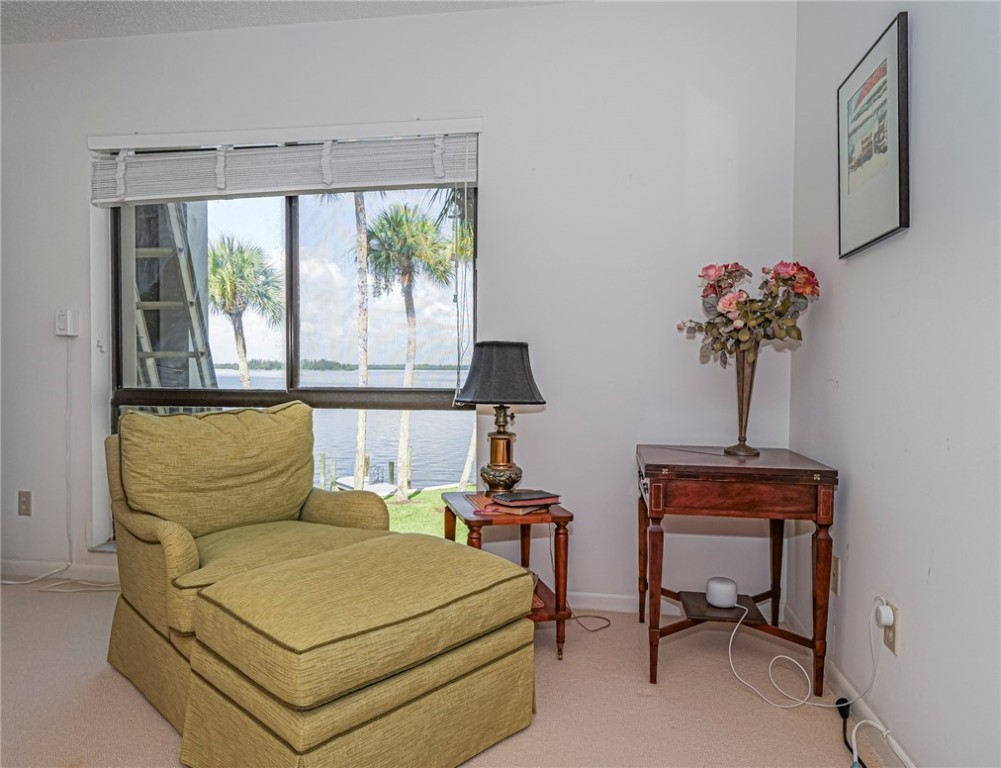 1001 Bay Road, Unit 205 Vero Beach, FL 32963 - Photo 19 of 36 a bedroom with a bed and a window