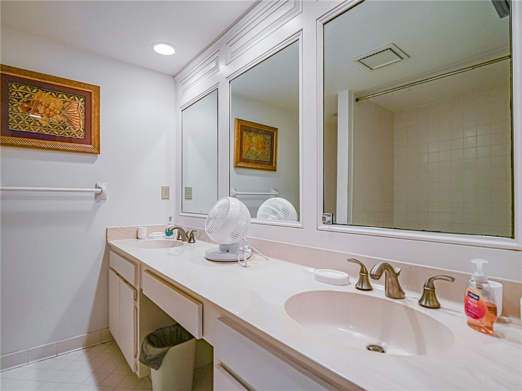 1001 Bay Road, Unit 205 Vero Beach, FL 32963 - Photo 20 of 36 a bathroom with a sink and a mirror