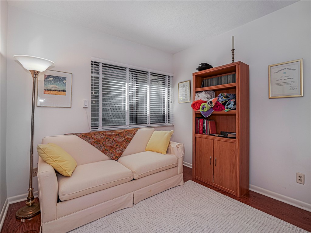 1001 Bay Road, Unit 205 Vero Beach, FL 32963 - Photo 28 of 36 a living room with furniture and a couch