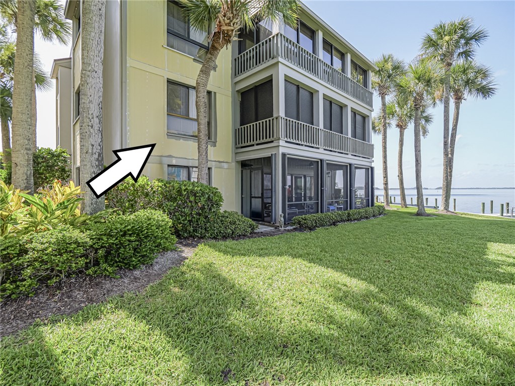 1001 Bay Road, Unit 205 Vero Beach, FL 32963 - Photo 29 of 36 a view of a house with a yard and plants