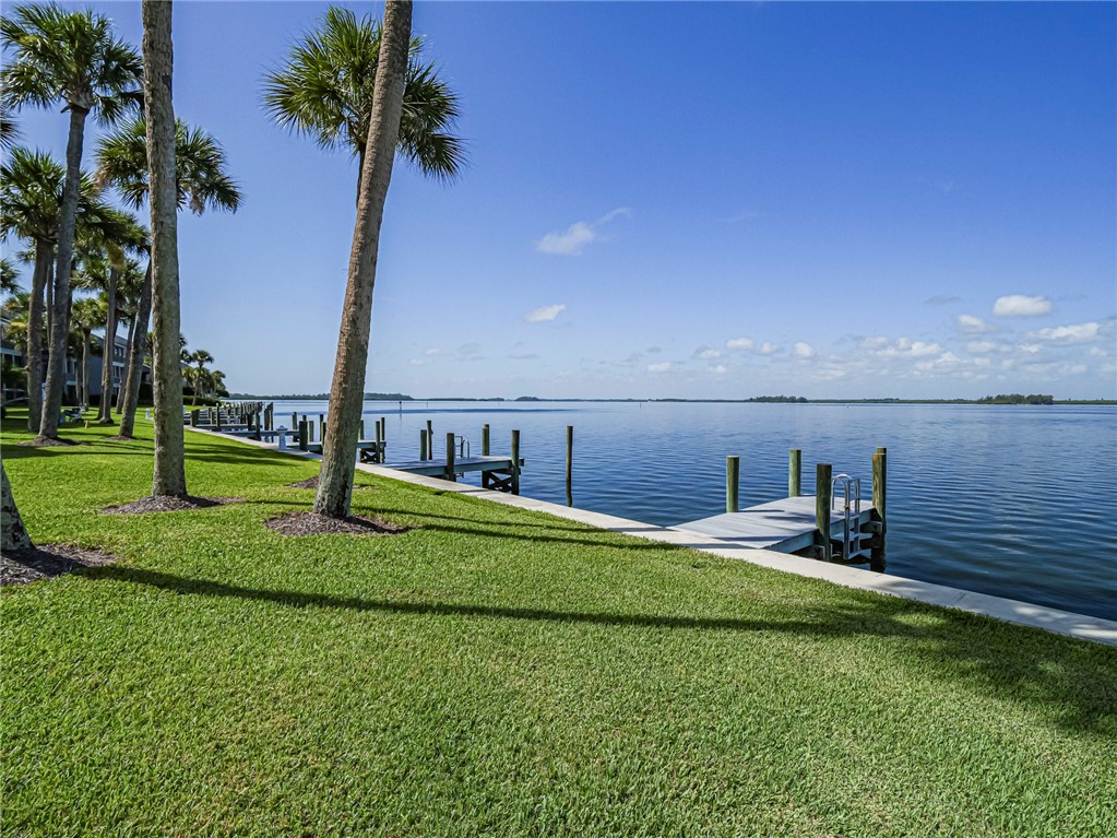 1001 Bay Road, Unit 205 Vero Beach, FL 32963 - Photo 33 of 36 a view of a lake with a palm tree