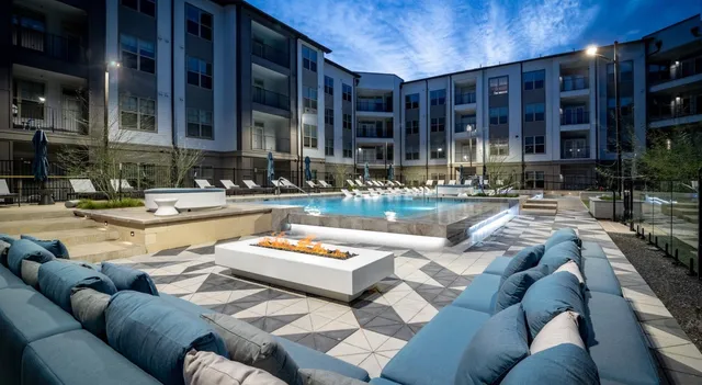 a kitchen with kitchen island white cabinets and stainless steel appliances