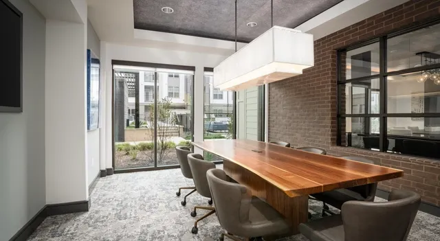 a dining room with furniture and wooden floor