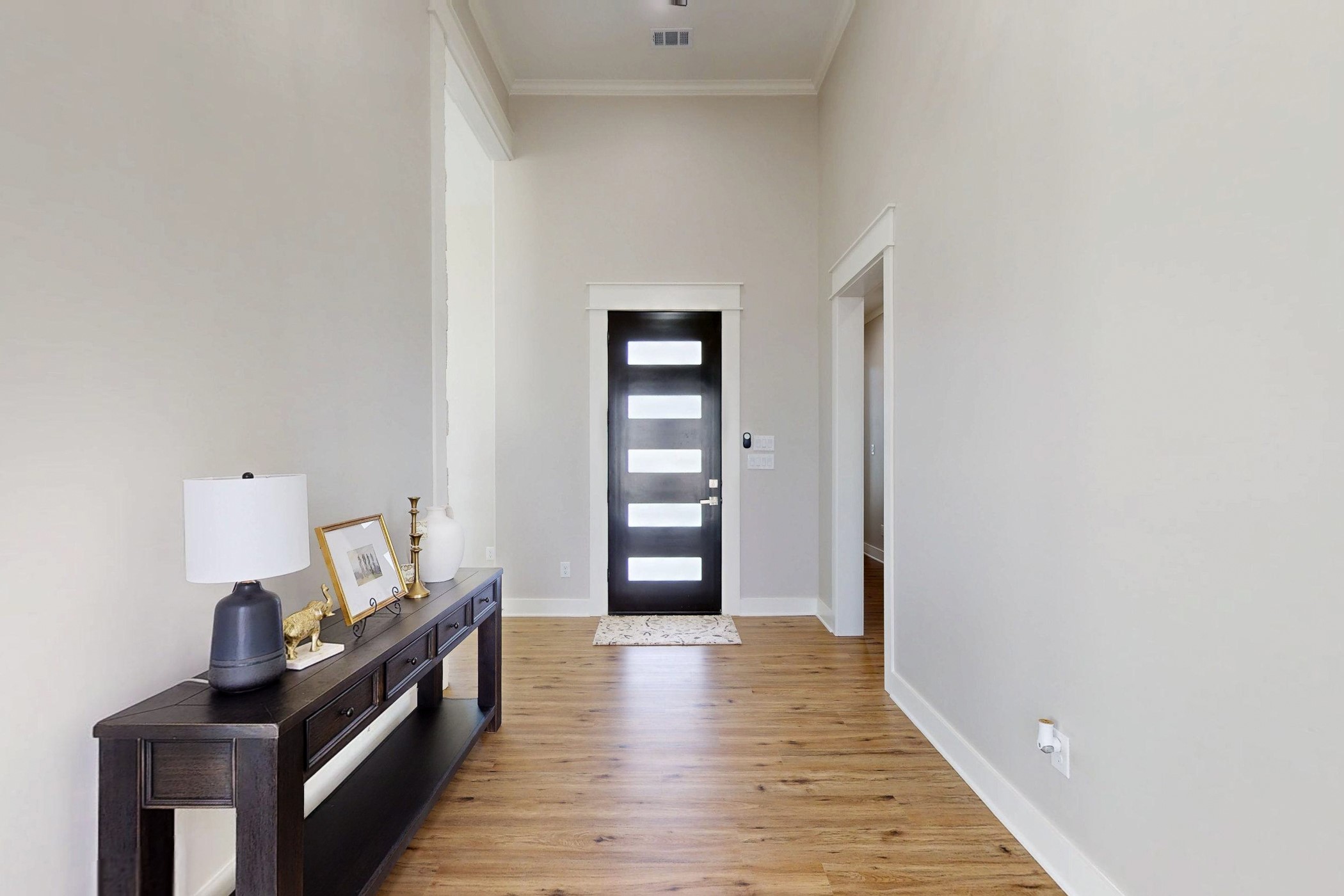 13504 Hudson Farms Road Franklin, TX 77856 - Photo 32 of 49 a view of a hallway with wooden floor and staircase