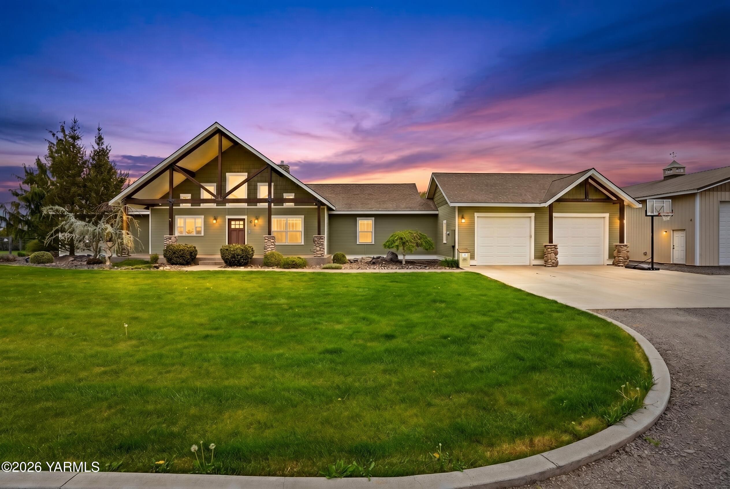 230 Albro Road Sunnyside, WA 98944 - Photo 2 of 46 a front view of a house with a garden