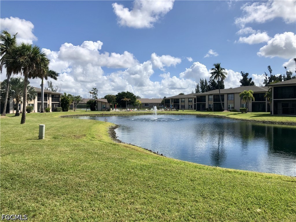 16881 Davis Road, Unit 214 Fort Myers, FL 33908 - Photo 30 of 46 a view of a lake with houses