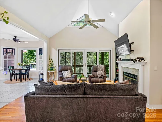 a bedroom with furniture and a potted plant