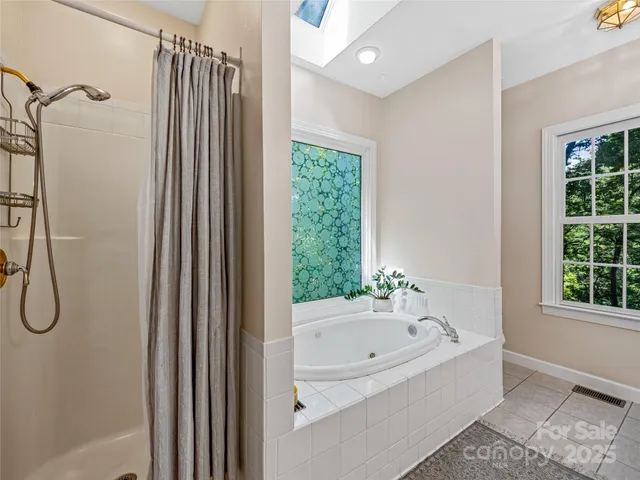 a bathroom with a sink a mirror a toilet and a mirror