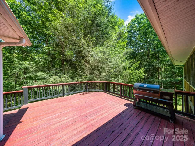 a view of house with a yard and sitting area