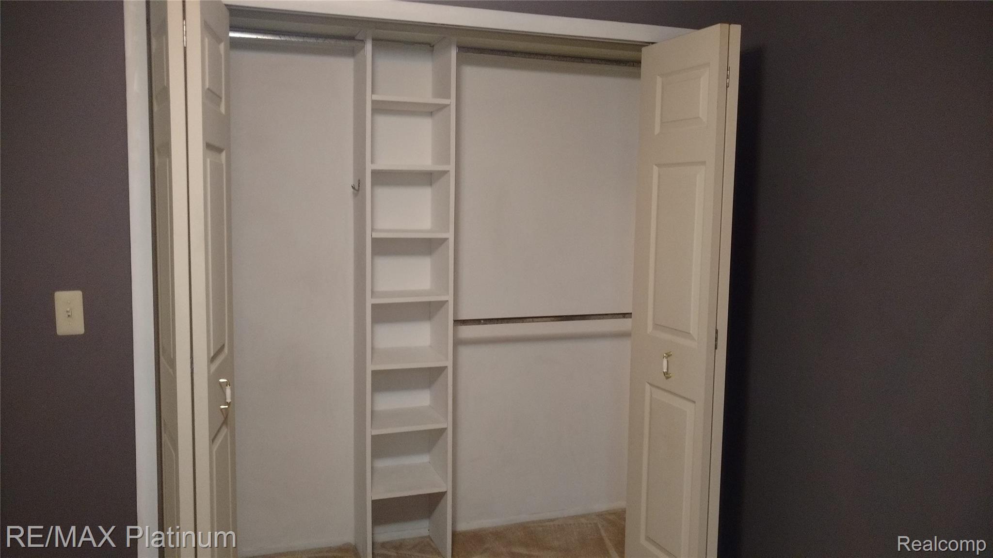 505 West Highland Road, Unit 25 Howell, MI 48855 - Photo 17 of 17 MASTER BEDROOM CLOSET