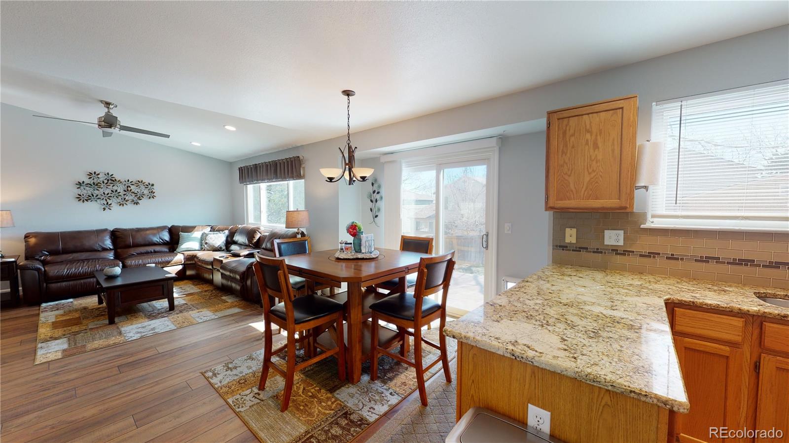 10482 Hyacinth Street Highlands Ranch, CO 80129 - Photo 17 of 40 a view of a dining room with furniture