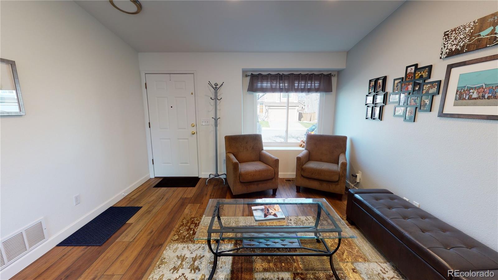 10482 Hyacinth Street Highlands Ranch, CO 80129 - Photo 3 of 40 a living room with furniture