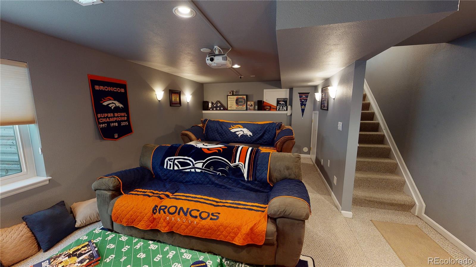 10482 Hyacinth Street Highlands Ranch, CO 80129 - Photo 33 of 40 a living room with furniture and wooden floor