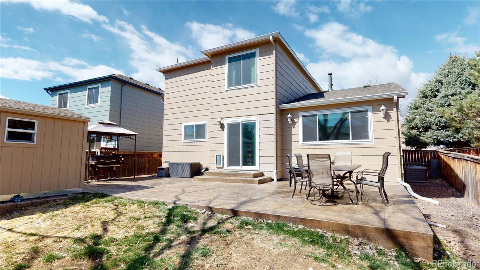 10482 Hyacinth Street Highlands Ranch, CO 80129 - Photo 36 of 40 a view of a house with outdoor seating