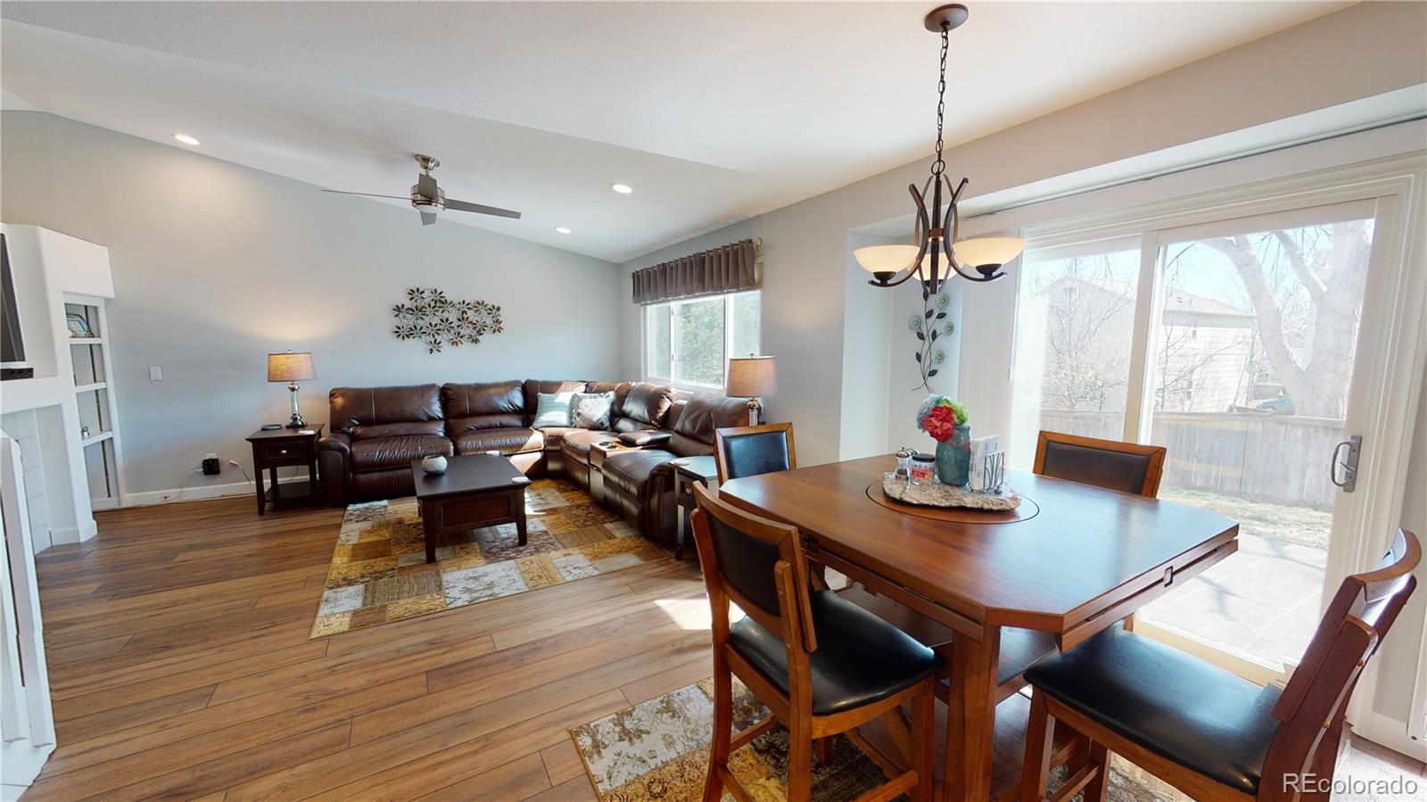 10482 Hyacinth Street Highlands Ranch, CO 80129 - Photo 7 of 40 a view of a dining room with furniture window and wooden floor