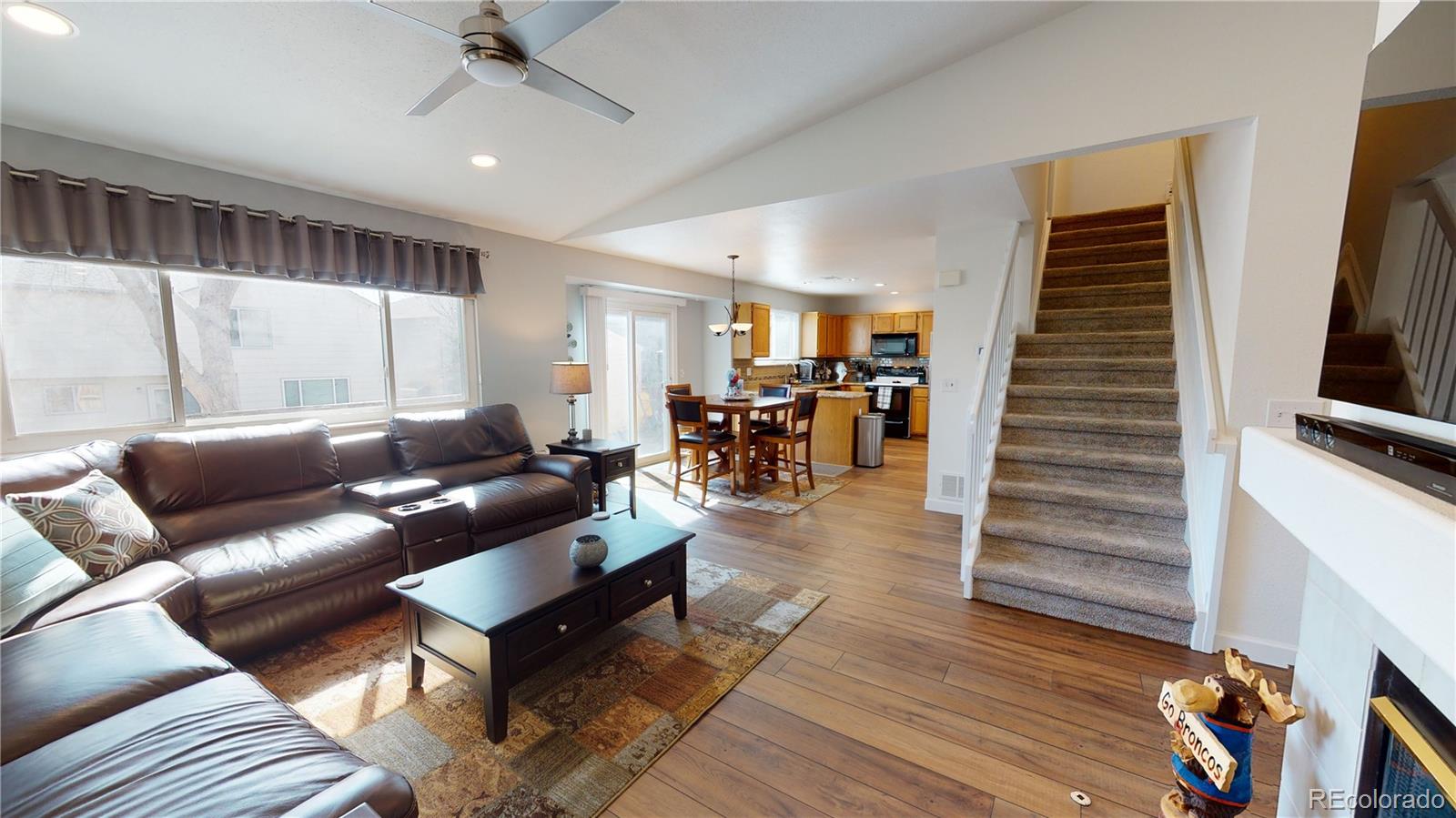 10482 Hyacinth Street Highlands Ranch, CO 80129 - Photo 10 of 40 a living room with furniture and wooden floor