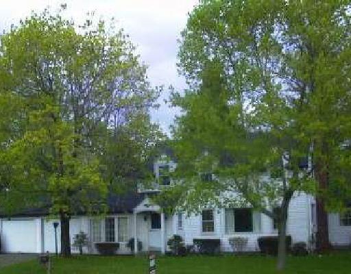 1 Kent Road Warren, CT 06754 - Photo 1 of 1 a front view of a house with a garden and trees