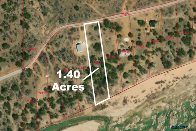 an aerial view of a houses with a street