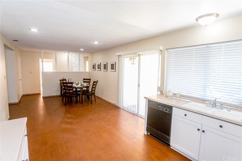 7446 El Morro Way Buena Park, CA 90620 - Photo 11 of 23 a view of a kitchen with dining table chairs and entryway
