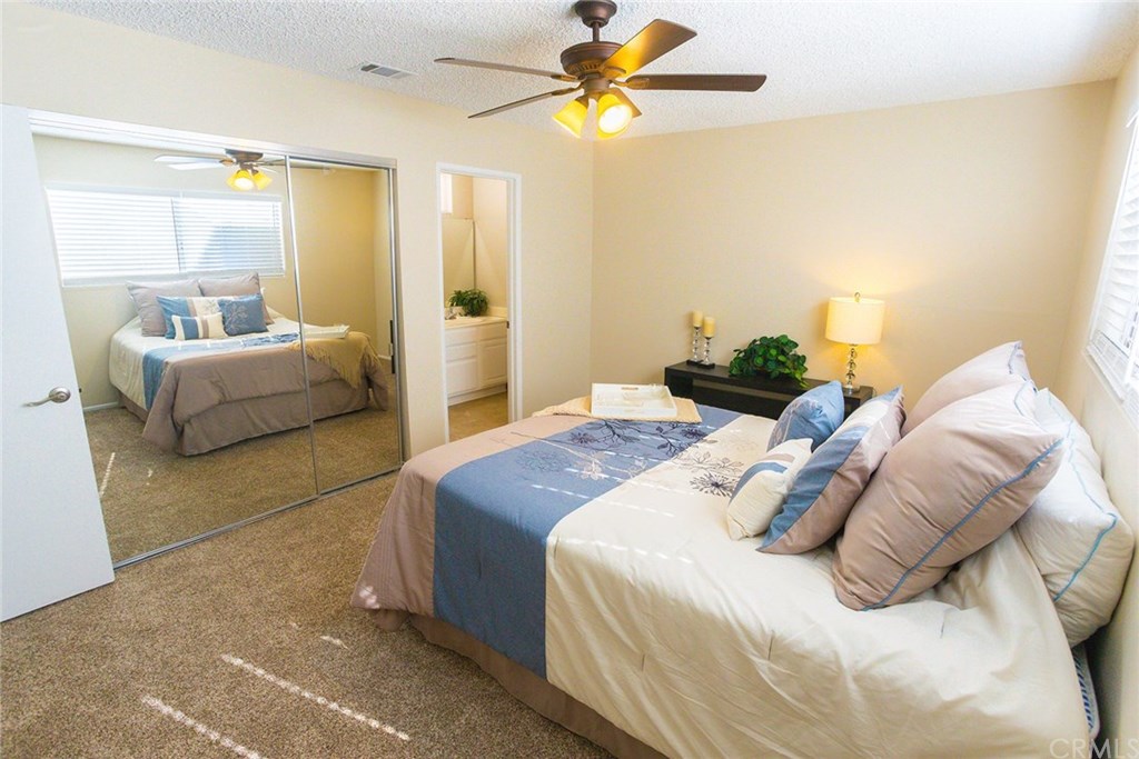 7446 El Morro Way Buena Park, CA 90620 - Photo 18 of 23 a bedroom with a bed and a couch