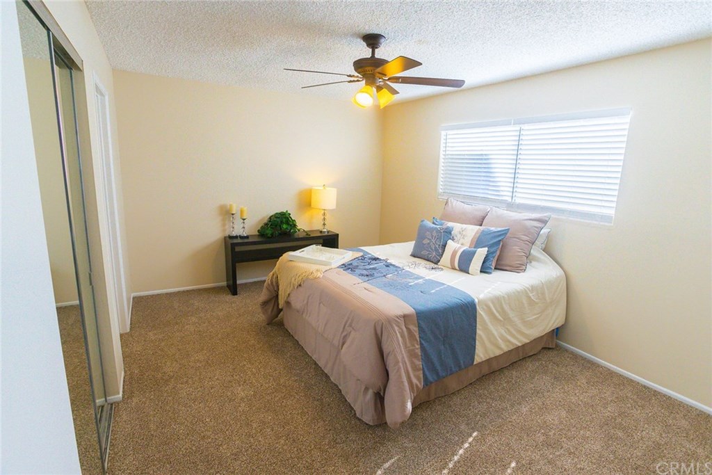 7446 El Morro Way Buena Park, CA 90620 - Photo 19 of 23 a bedroom with a bed and a window