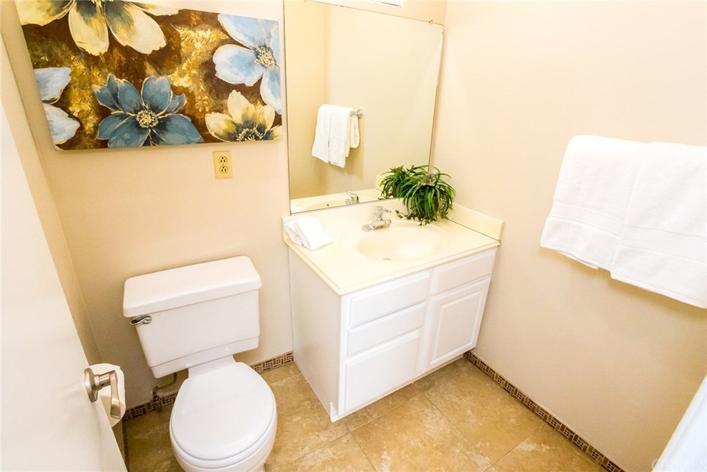 7446 El Morro Way Buena Park, CA 90620 - Photo 20 of 23 a bathroom with a sink mirror vanity and toilet