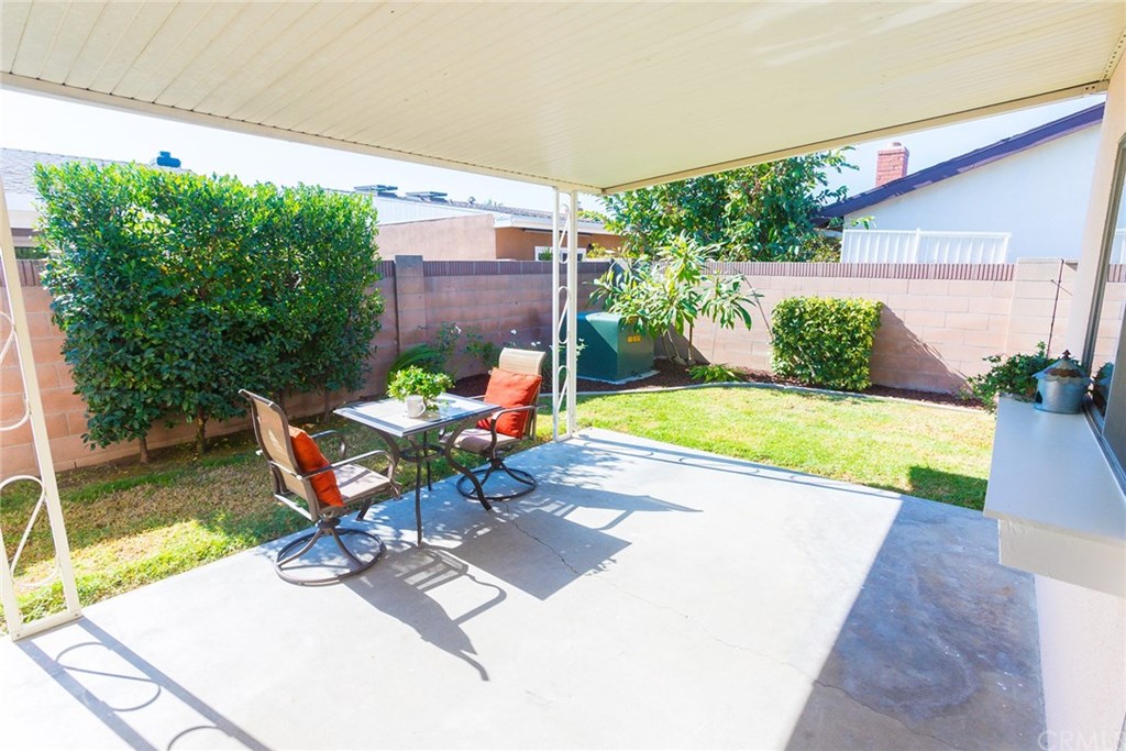 7446 El Morro Way Buena Park, CA 90620 - Photo 22 of 23 a view of a chair and table in backyard of the house