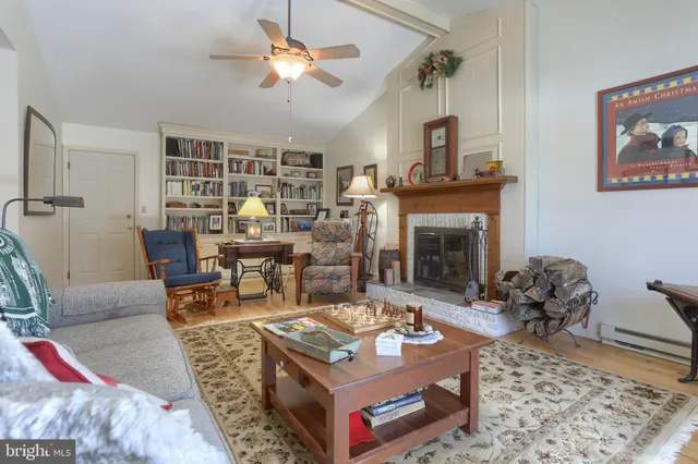 a workspace with furniture and a book shelf