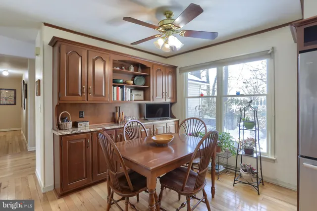 a kitchen with refrigerator and cabinets