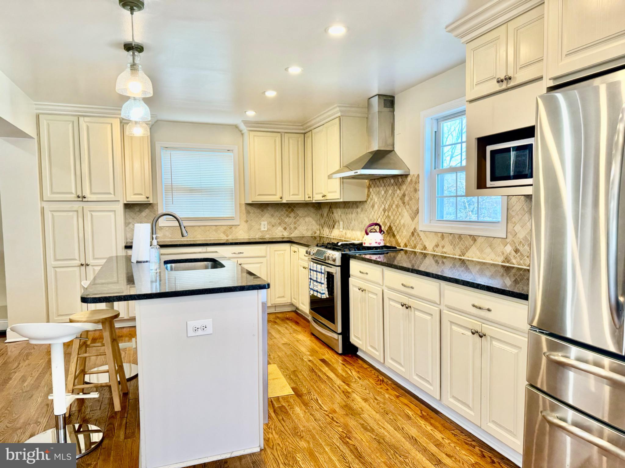 3210 Harford Road Baltimore, MD 21218 - Photo 11 of 33 a kitchen with stainless steel appliances granite countertop a sink stove and refrigerator