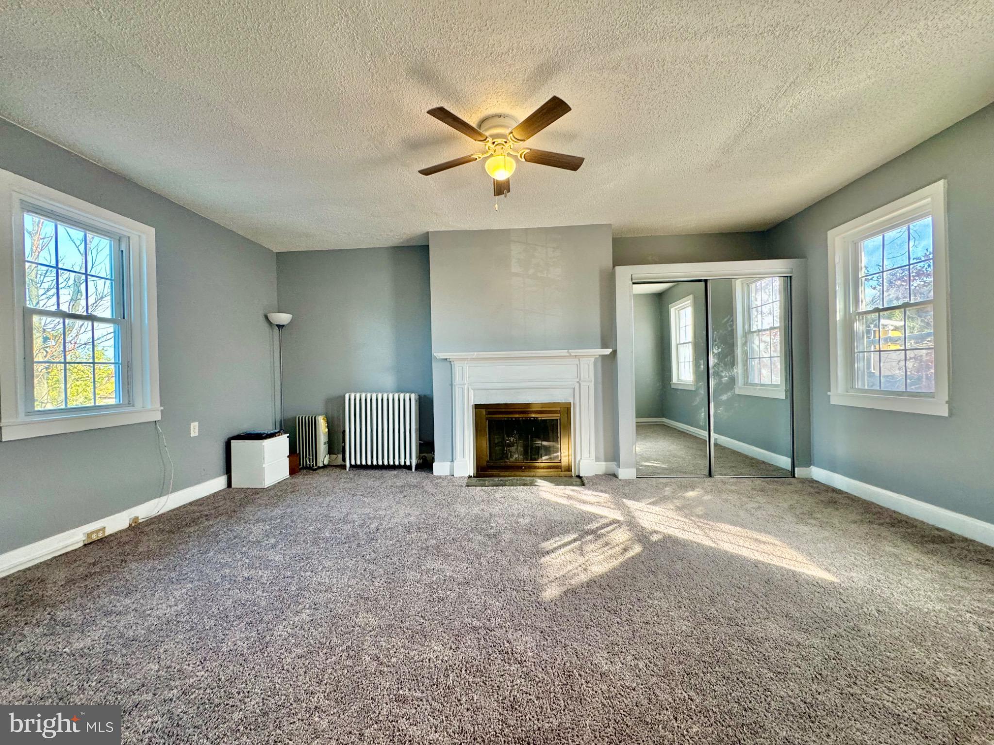 3210 Harford Road Baltimore, MD 21218 - Photo 15 of 33 a view of an empty room with window and fireplace