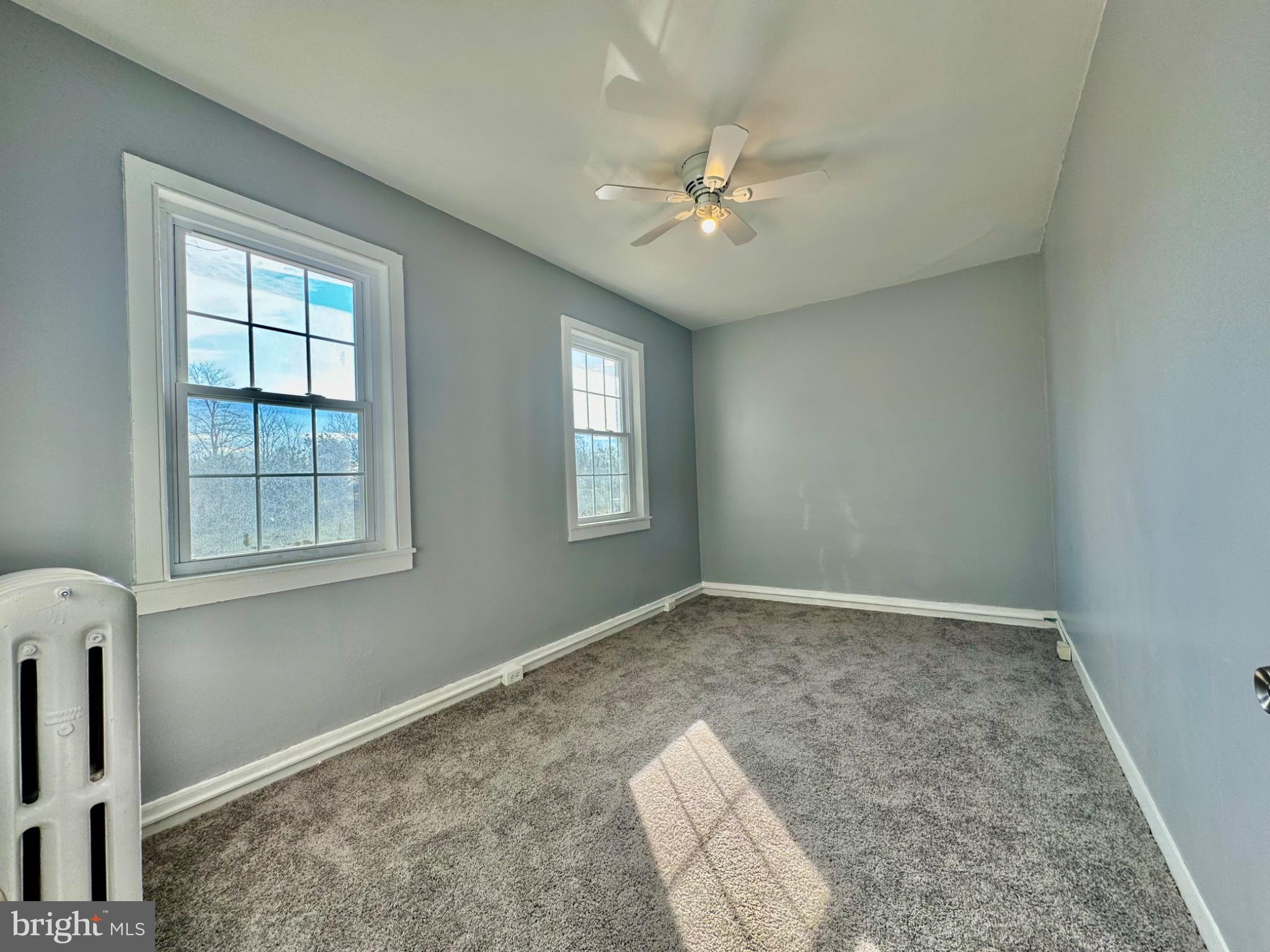 3210 Harford Road Baltimore, MD 21218 - Photo 20 of 33 a view of an empty room with chandelier fan and fire place