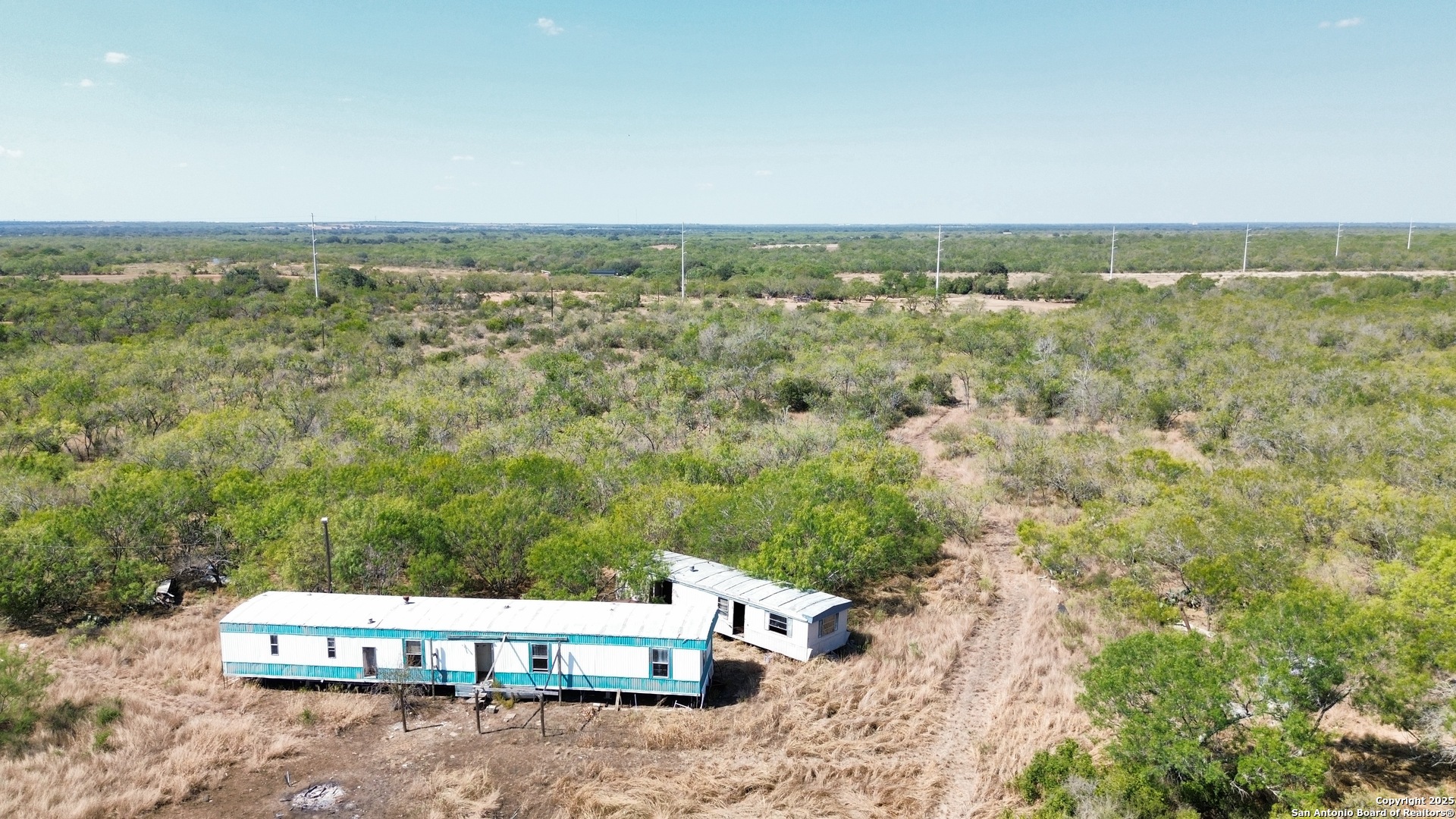 7365 Leal Road Pleasanton, TX 78064 - Photo 6 of 6 an aerial view of house with yard