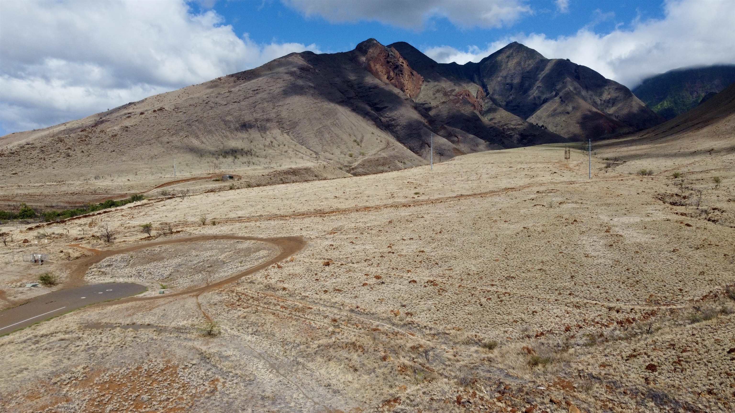 a view of wooden fence in front of a house