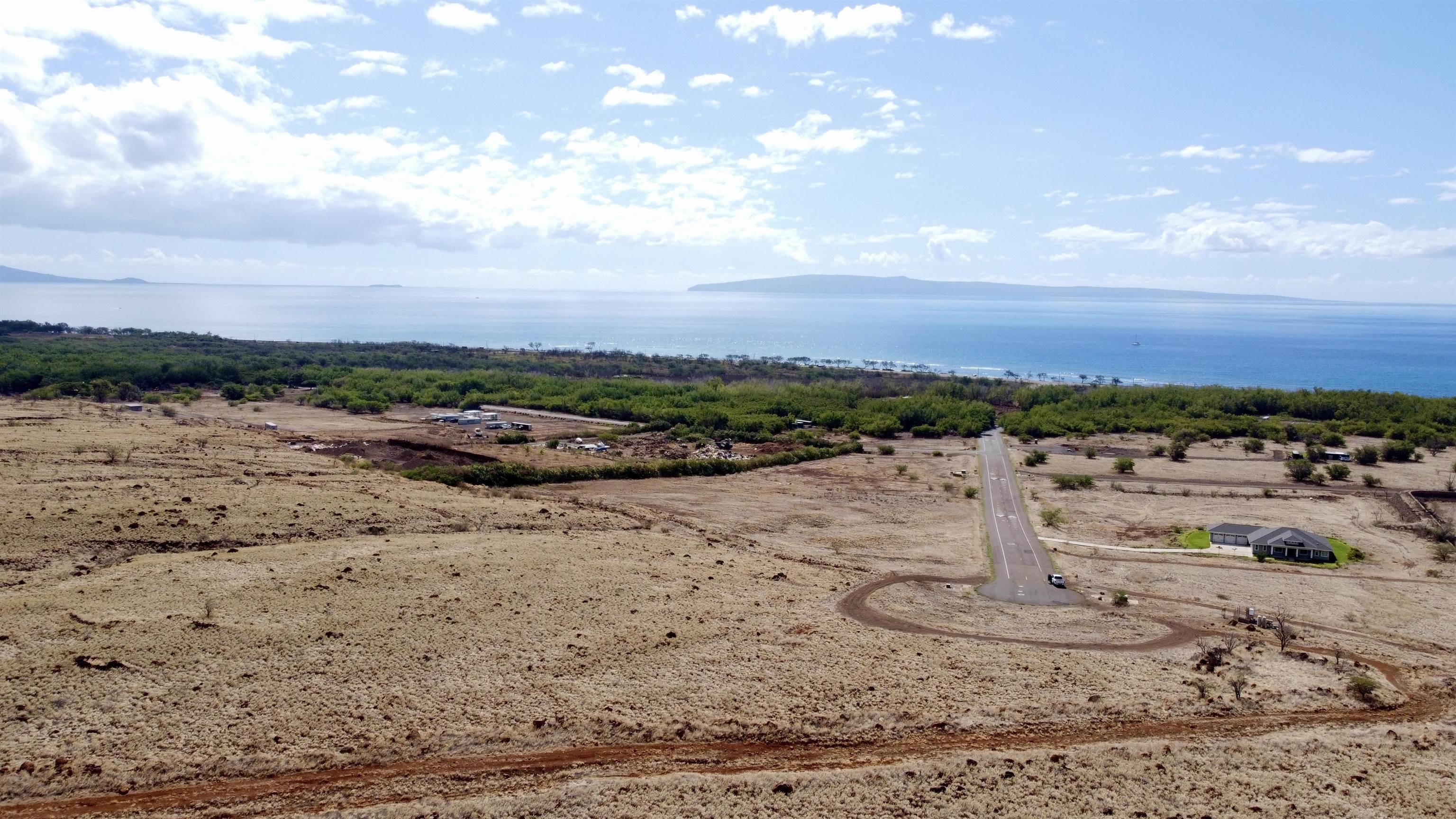 Pohaku Aeko Street, Unit 31A Lahaina, HI 96761 - Photo 11 of 14 a view of a lake with a beach