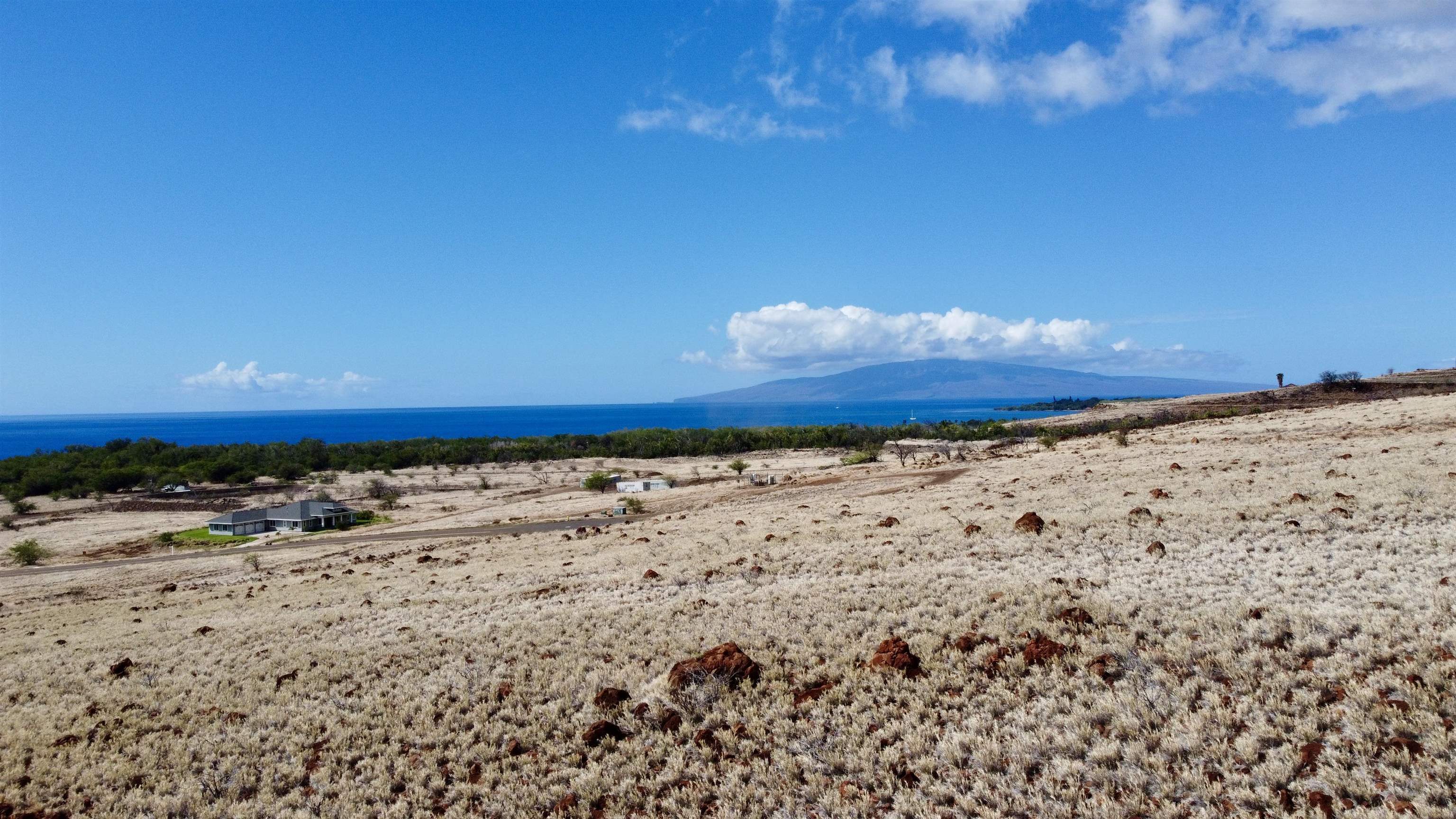 Pohaku Aeko Street, Unit 31A Lahaina, HI 96761 - Photo 14 of 14 a view of a beach with a yard